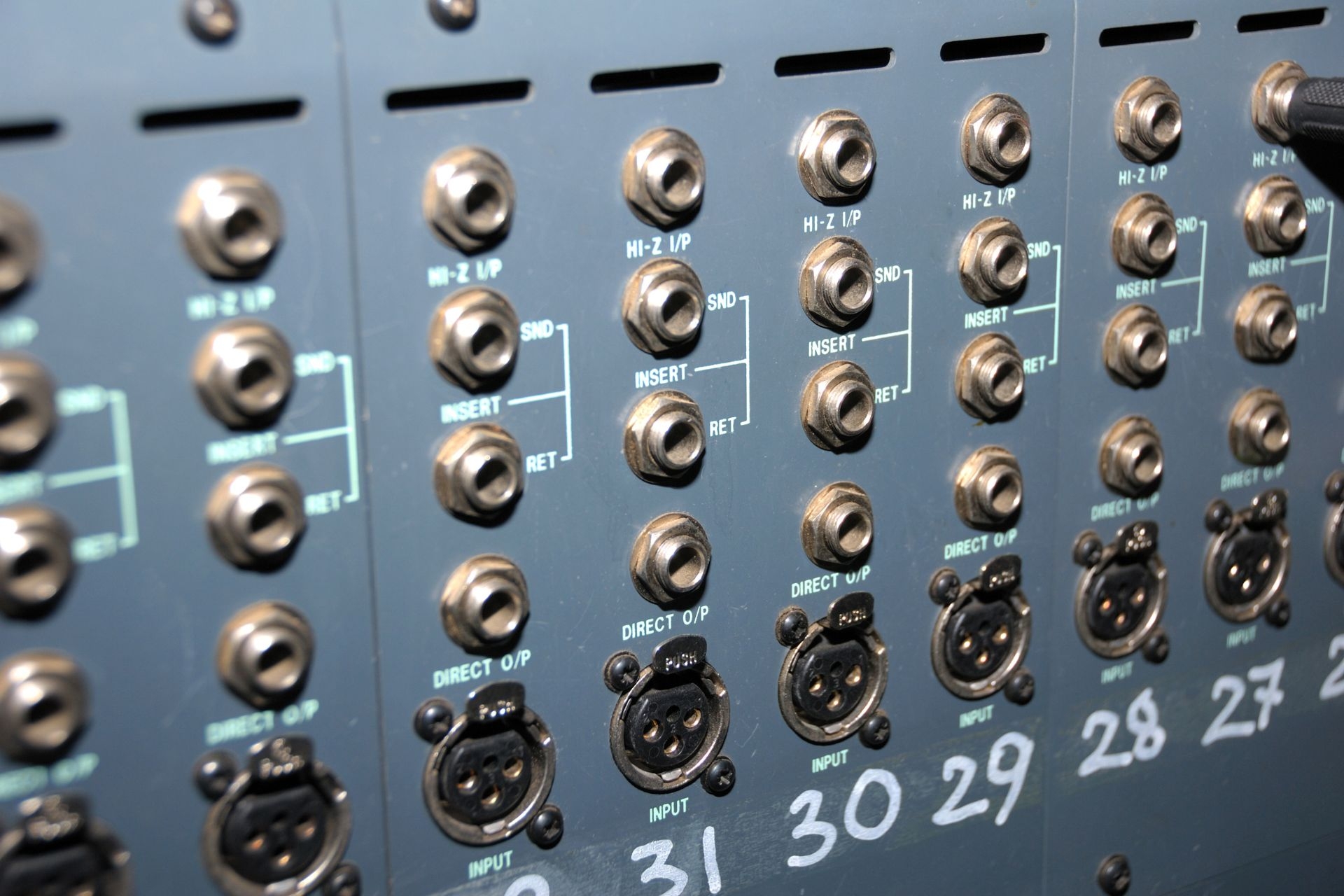 How does the crop factor of an APS-C sensor affect the field of view of a lens?