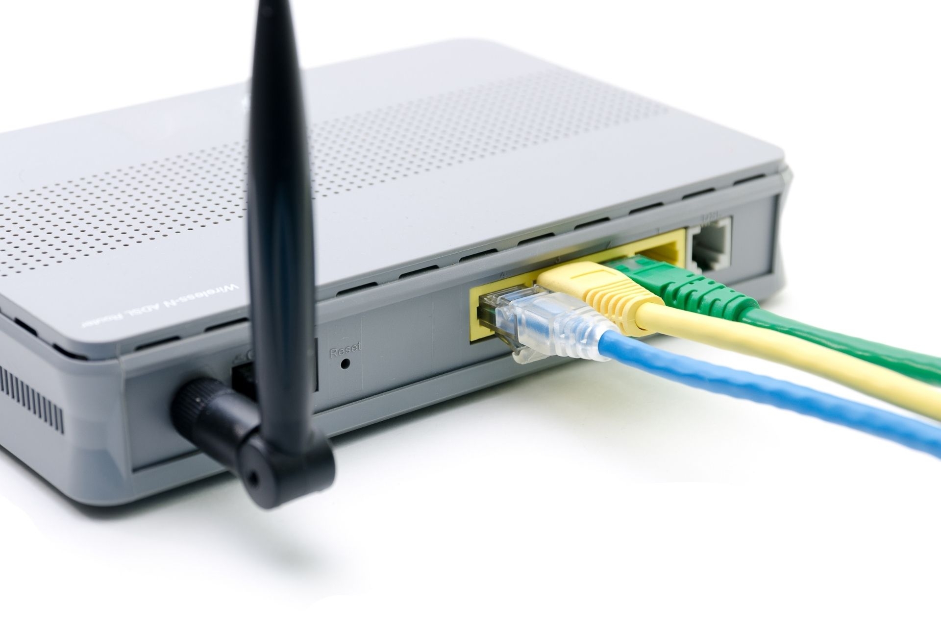 How do optical transmitters minimize signal loss over long distances?