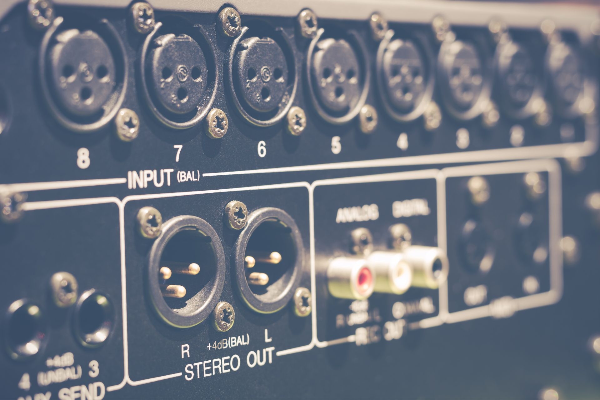 How can a patchbay be used to integrate outboard gear into a digital audio workstation setup?