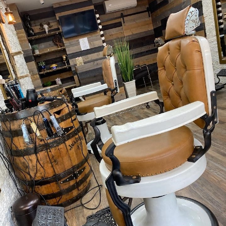 What services are typically offered at modern men's grooming studios?